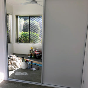 White framed, combination one mirror/one Glacier (white) vinyl wardrobe sliding doors