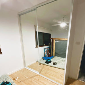 White framed, mirror inserts wardrobe sliding doors