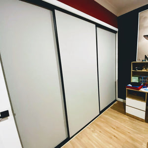 Black framed, white vinyl inserts, wardrobe sliding doors