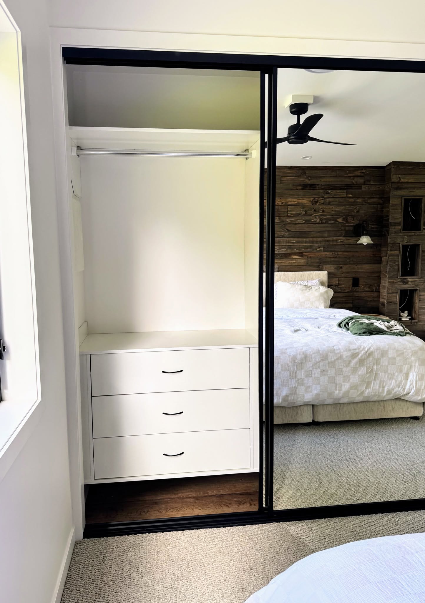 Wardrobe shelving with mirror doors