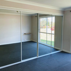 White framed, mirror inserts wardrobe sliding doors