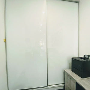 Matt Natural frames, with pure white painted glass inserts, wardrobe sliding doors
