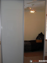 Framed Painted Glass Sliding Wardrobe Doors - Pure White on left, Mirror on right, Matt Natural Frames