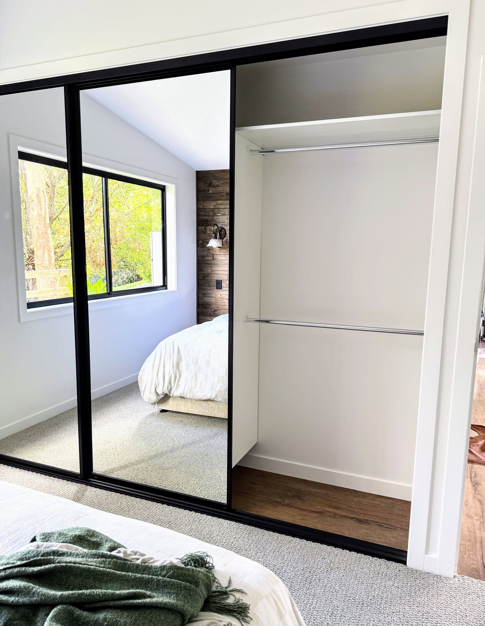 Wardrobe shelving with mirror doors