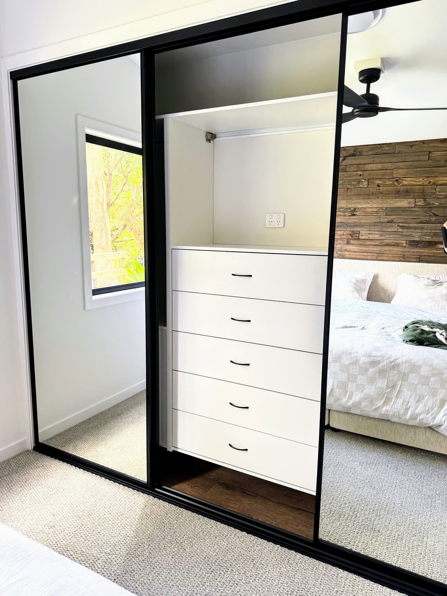 Wardrobe shelving with mirror doors